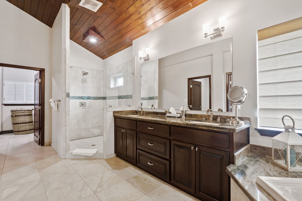 Master bath (1st floor) features oversized shower, large double vanity, closet