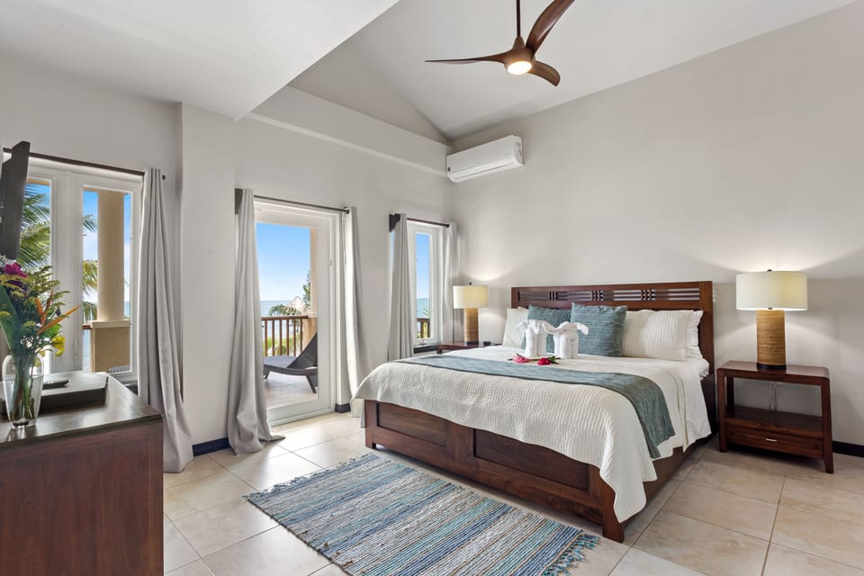 Master bedroom (2nd floor) with king bed, en suite bath, balcony with ocean view