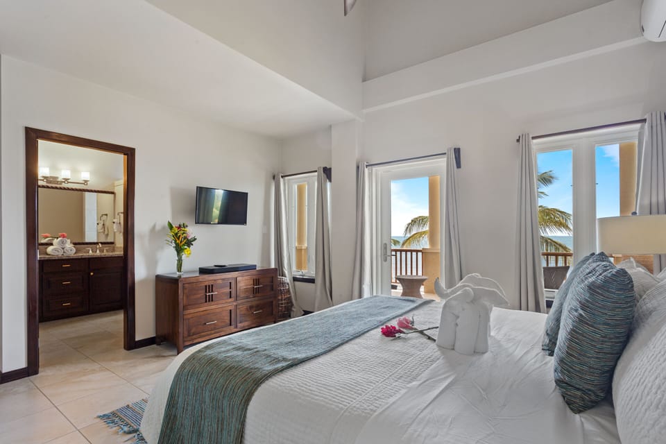 Master bedroom (2nd floor) with king bed, en suite bath, balcony with ocean view