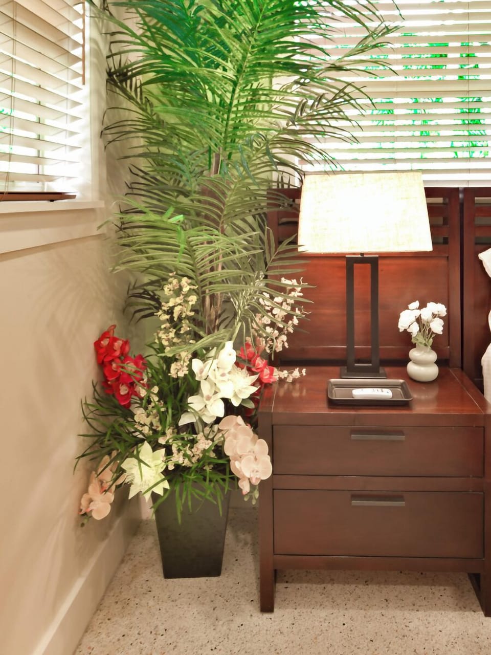 Palm and Tropical Flowers by Nightstand