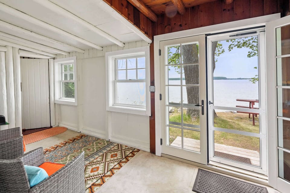 Screened in front porch with views of water and sunsets!