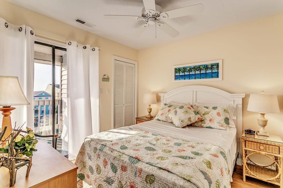 Comfortable queen size bed. Access to patio.