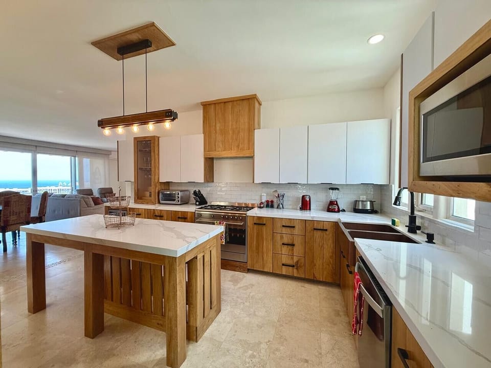 Cook, dine, and relax in a bright, open-concept layout.