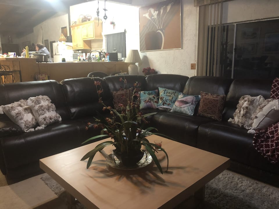 Living room new leather like couch  3 recliners. Very comfortable  sleep? 