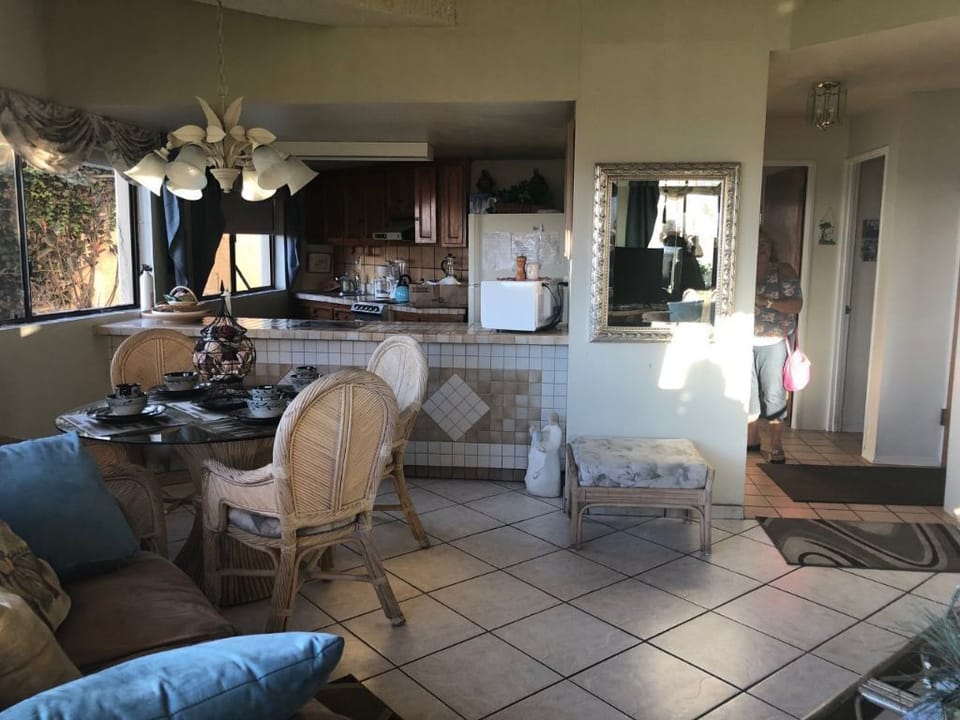 Living and dining. Condo in front of beach   Light and bright  hear    waves