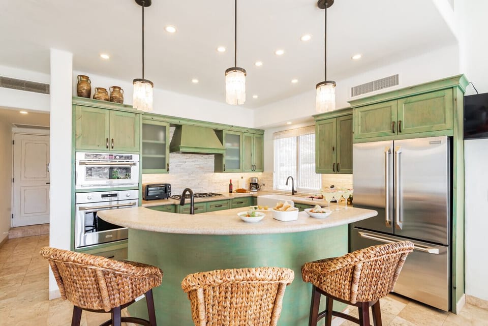 The kitchen is well equipped with stainless steel appliances