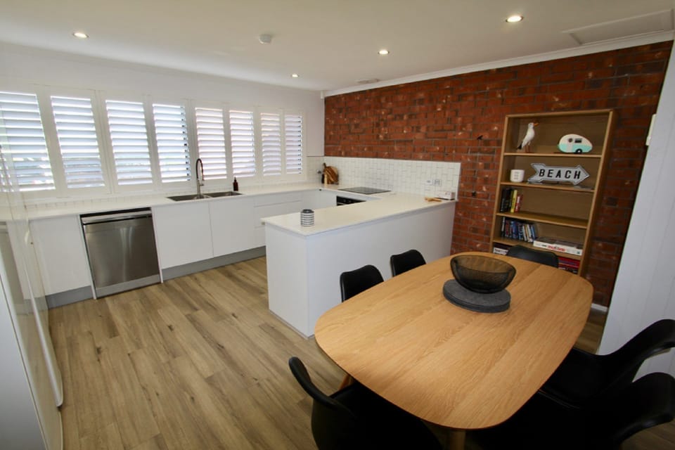 Spacious Two-Level Layout. Open-plan living, dining, and kitchen zones across two levels.