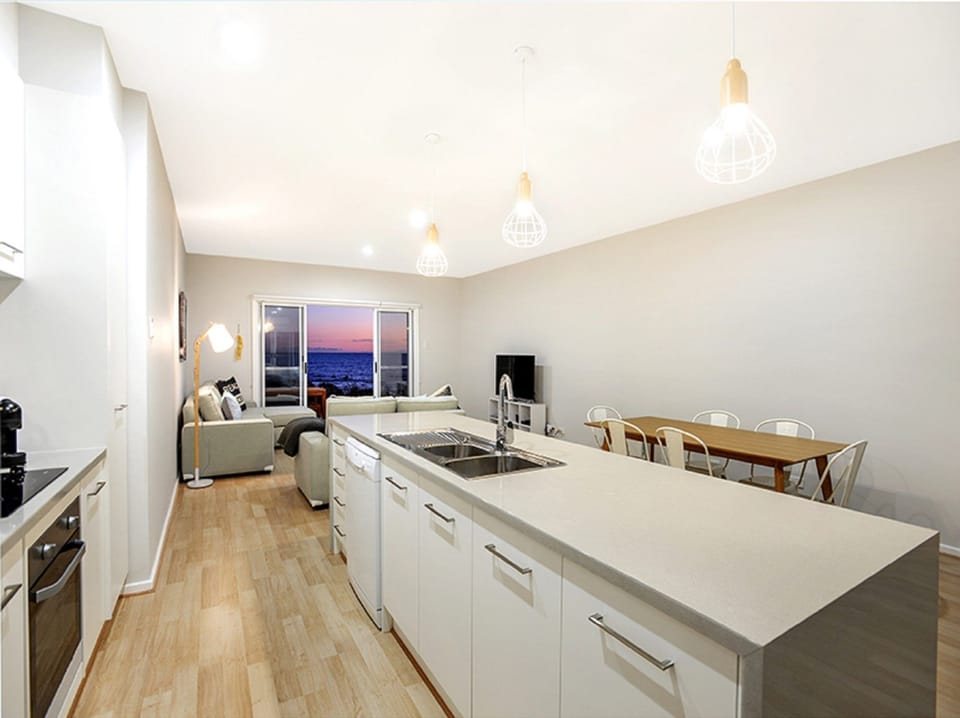 Features a fully equipped kitchen and a shaded rear BBQ area for alfresco dining, ensuring convenience and comfort for extended stays.