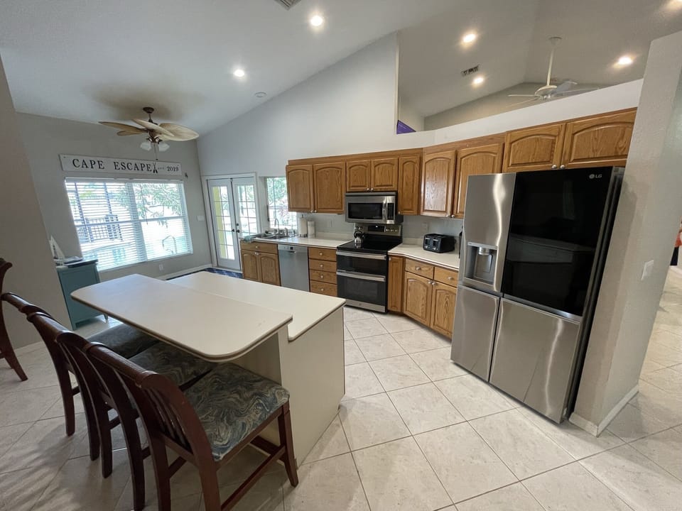 Stocked kitchen boasts double oven and craft ice in the refrigerator