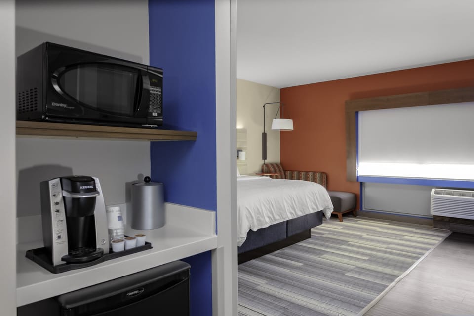 Suite, 1 King Bed | In-room safe, desk, laptop workspace, iron/ironing board