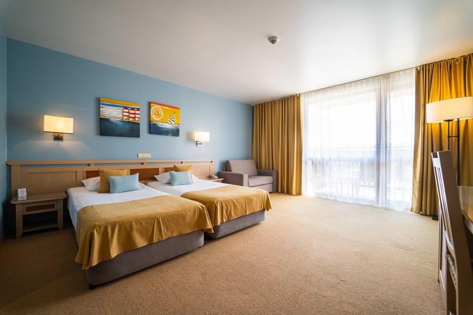 Standard Double Room, Balcony, Partial Sea View | Minibar, in-room safe, desk, soundproofing