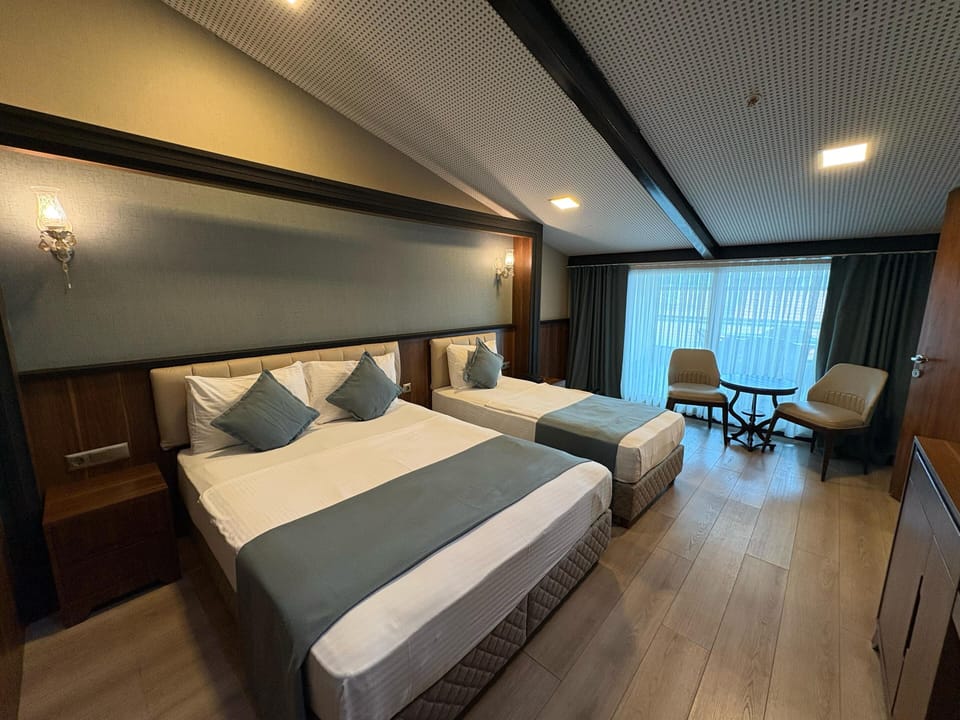 Connected Family Room | Premium bedding, minibar, in-room safe, blackout drapes