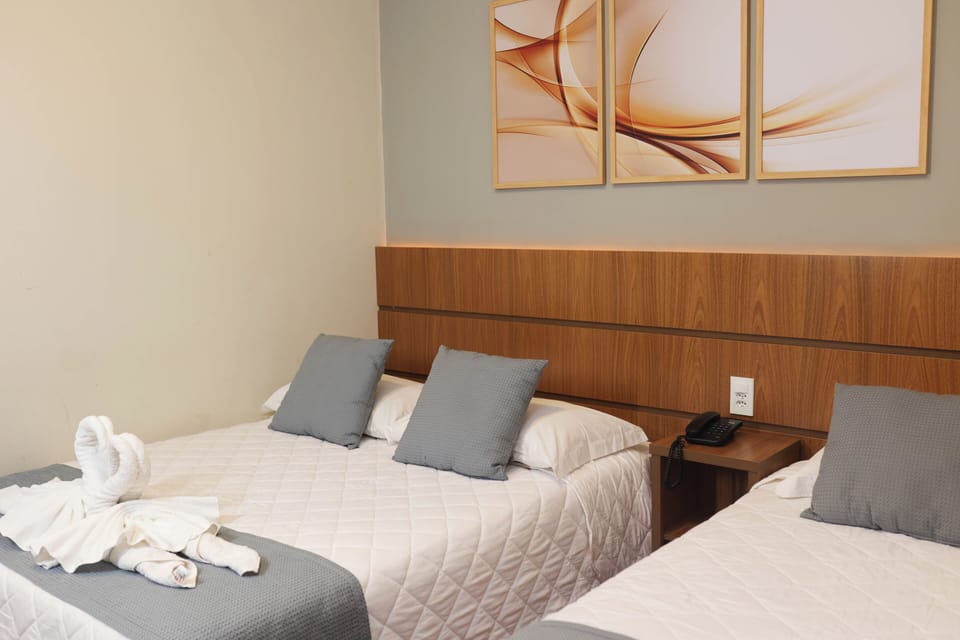 Standard Triple Room | Minibar, iron/ironing board (on request), WiFi (free), bed sheets