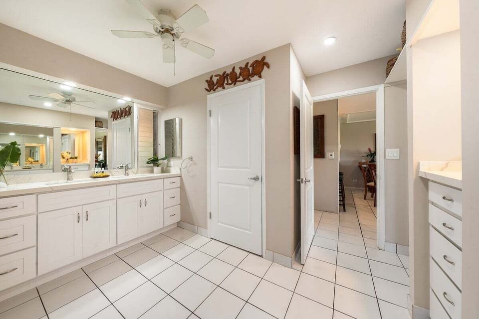Full bathroom with tiled shower and vanity