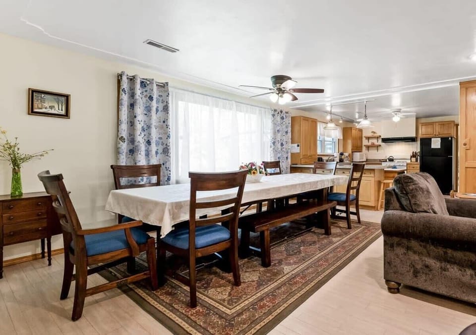 White Oaks Haven dining area with long dining table for everyone (up to 12 total guests) to eat together