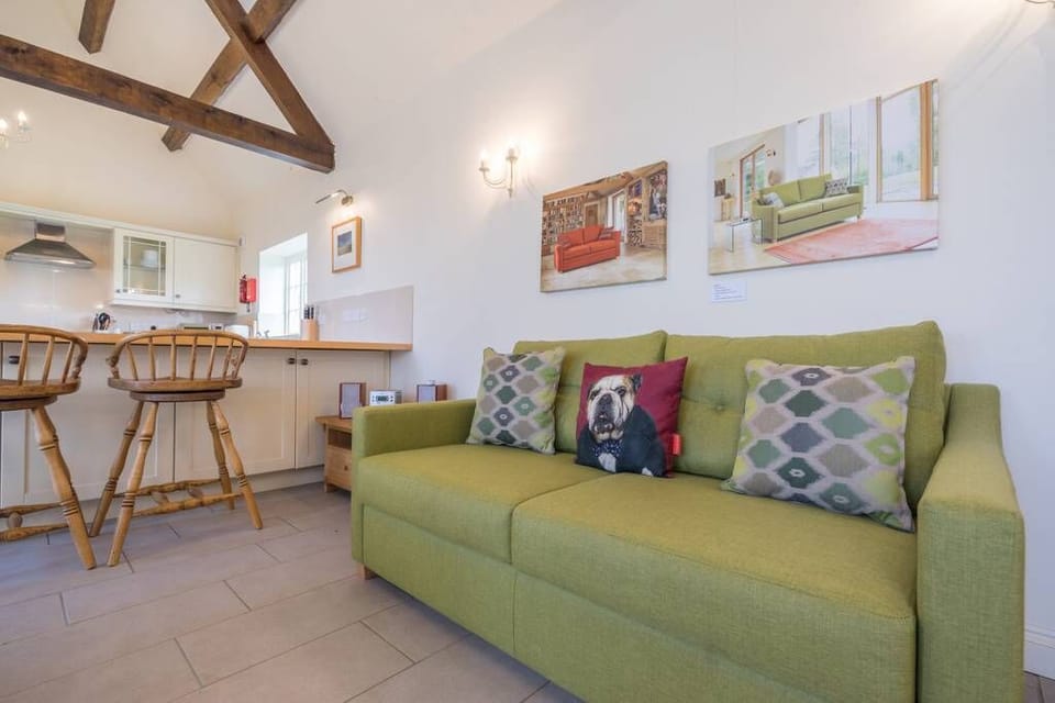 Comfy sofa, television and breakfast bar