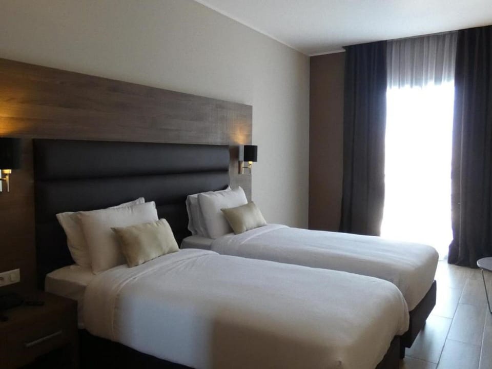 Double or Twin Room | Desk, blackout drapes, WiFi (free), bed sheets