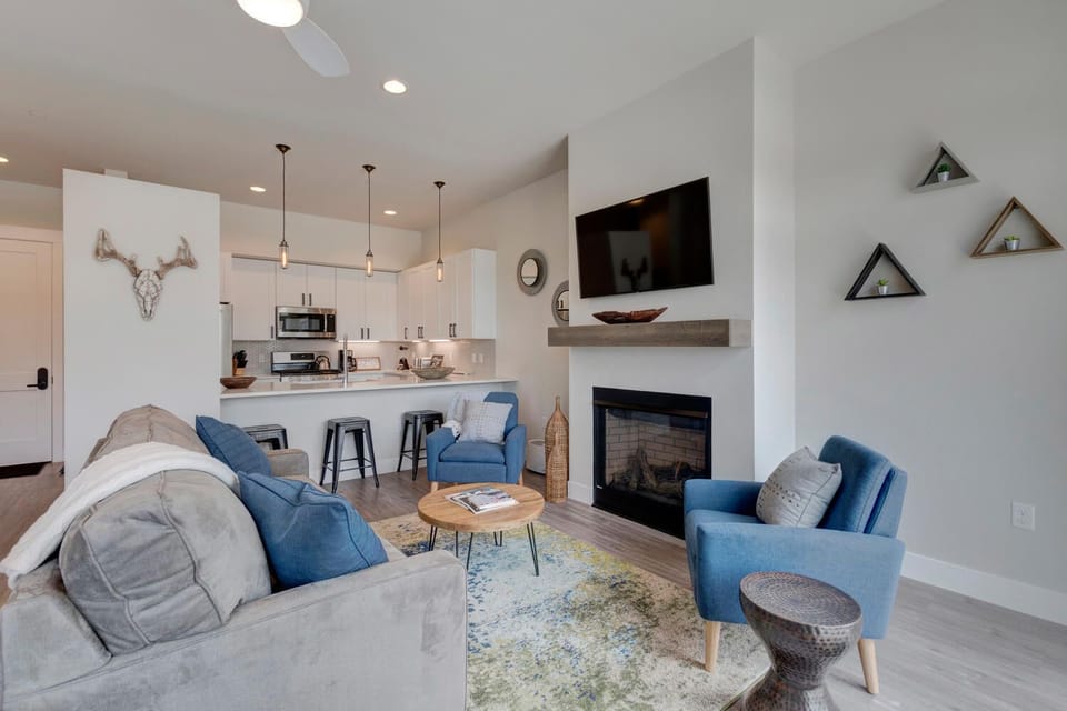 Main Living Area Opens to Beautiful White Chef's Kitchen.