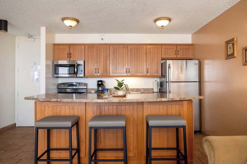 Enjoy casual meals or a morning coffee at the convenient breakfast bar, providing a comfortable and inviting spot for dining within your fully equipped kitchen.