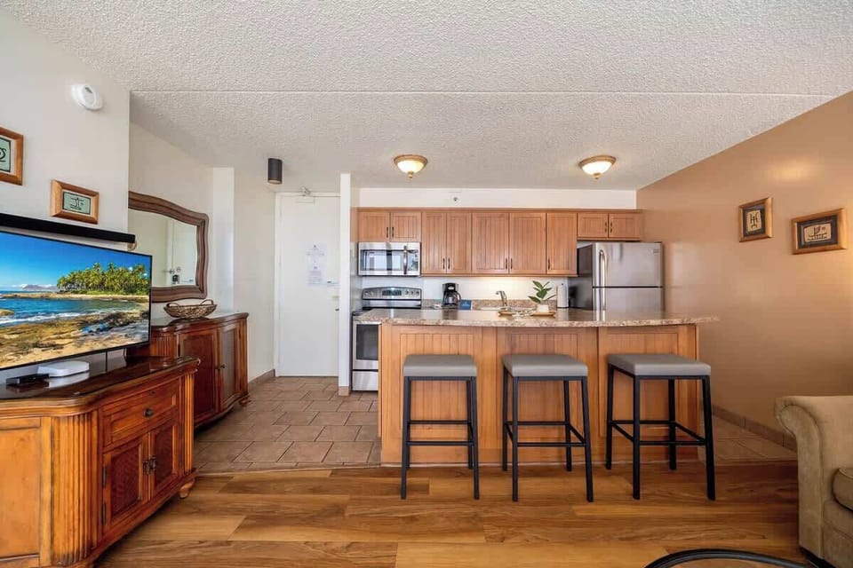 Enjoy casual meals or a morning coffee at the convenient breakfast bar, providing a comfortable and inviting spot for dining within your fully equipped kitchen.