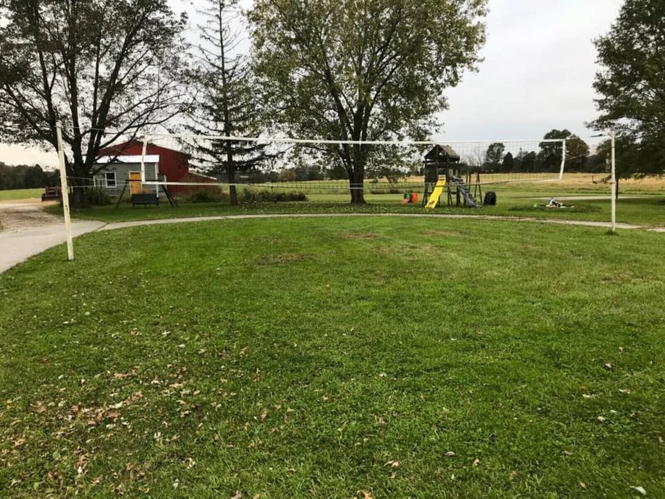 Volleyball, playground, and sandbox.