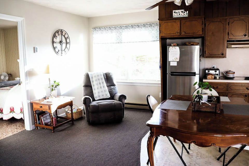 Book corner and reclining chair next to the big windows. 