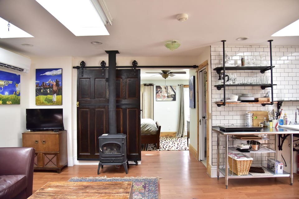 Barn door separates bedroom from great room