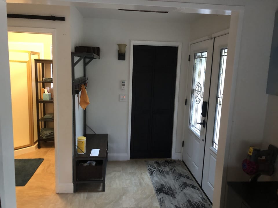 Entry way with 3/4 bath by the front door