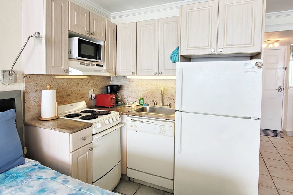 Kitchenette with full refrigerator, microwave, 4 burner / oven, dishwasher, coffee maker, toaster, etc.