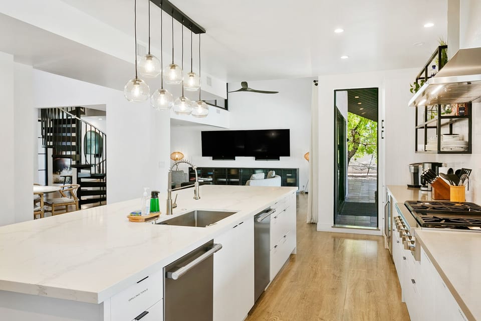 Bright kitchen with high-end appliances and 2 dishwashers