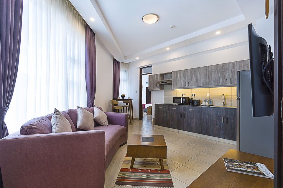 Family Duplex, Multiple Beds, City View | Living area | 52-inch Smart TV with cable channels, TV