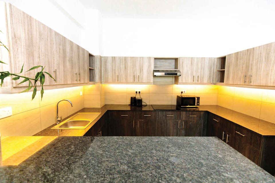 Family Duplex, Multiple Beds, City View | Shared kitchen | Full-size fridge, microwave, stovetop, coffee/tea maker