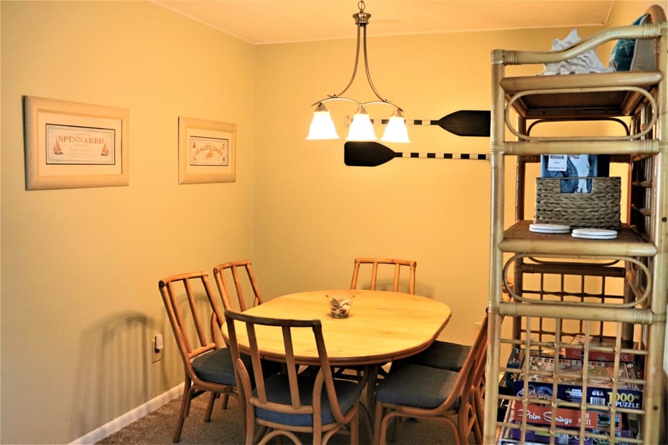 Gather around your inviting dining table for memorable meals with family and friends in this warm, nautical-themed space.