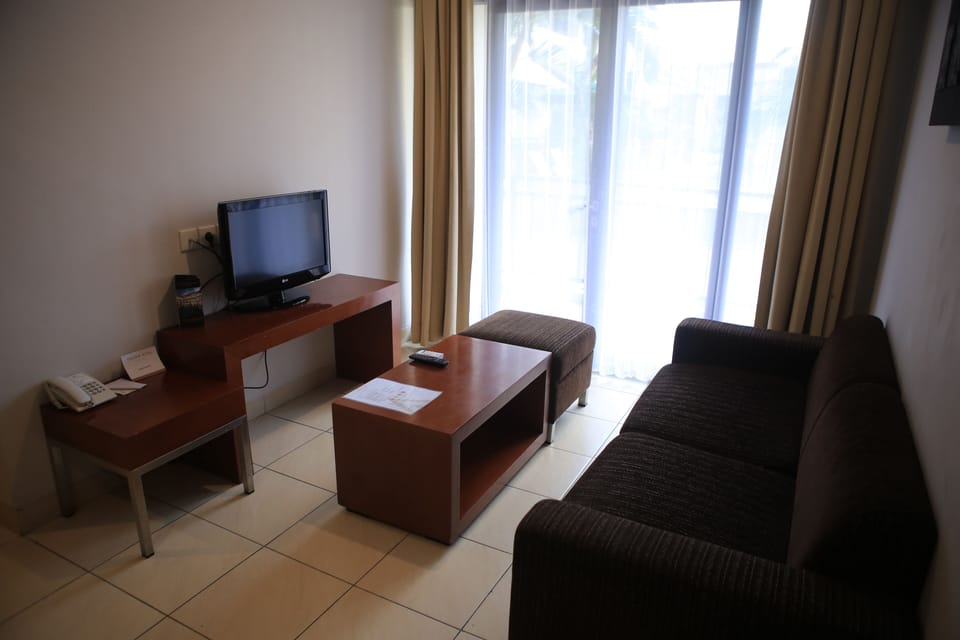 Junior Suite, 2 Bedrooms | Living area | LCD TV