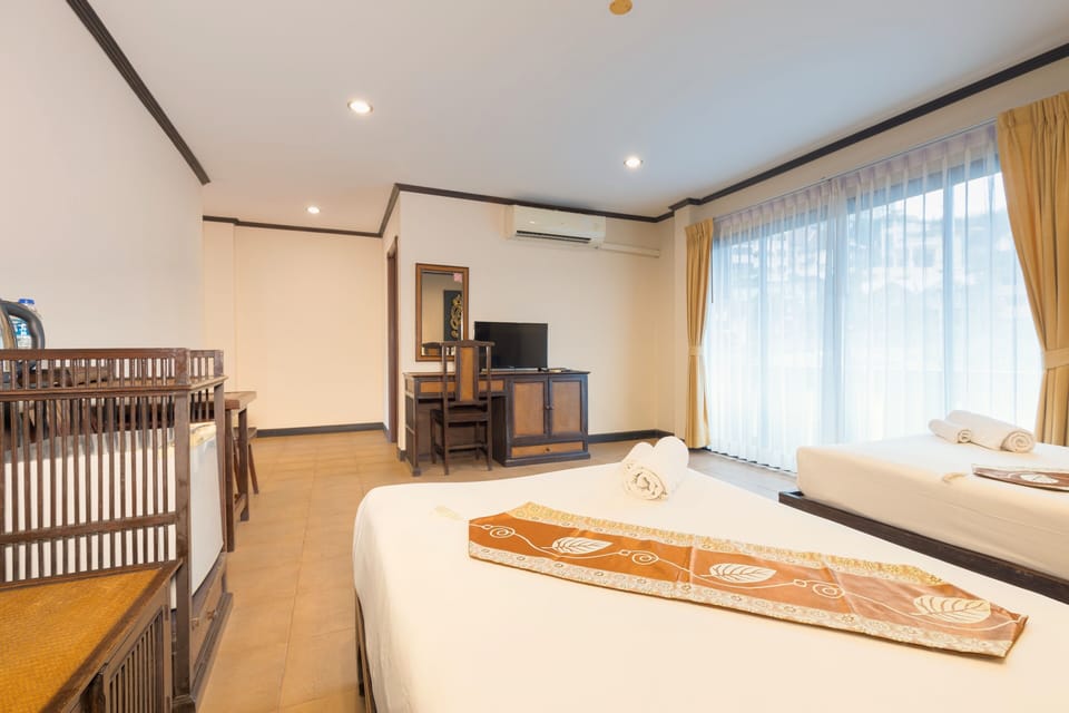 Family Suite, Multiple Beds, Balcony | Minibar, in-room safe, desk, laptop workspace