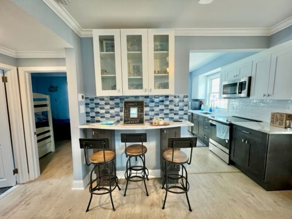 Bar area leading into kitchen