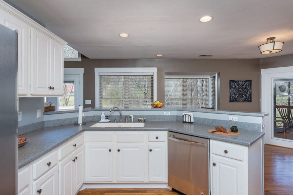 Spacious kitchen with stainless appliances, dishwasher, and two types of coffeemakers (Standard Drip & Keurig).