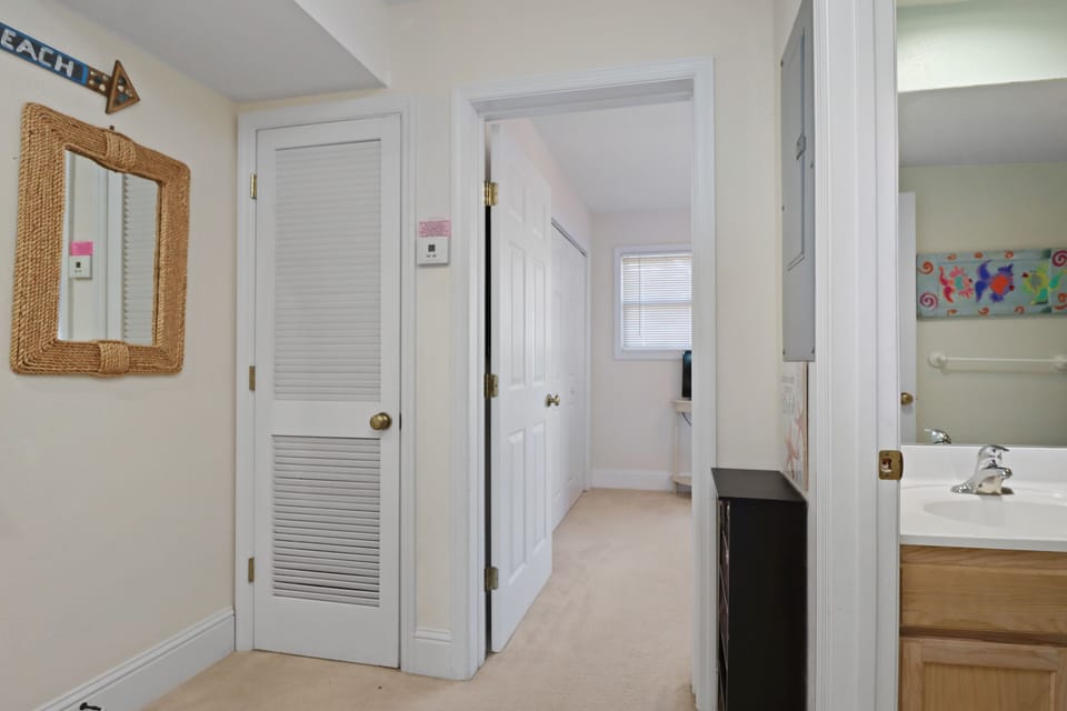 Main Floor Hallway with Full Bath and Bedroom 1