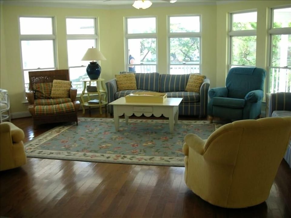 Large Family Room with Flat Screen TV opens to Kitchen and Dining Room.
