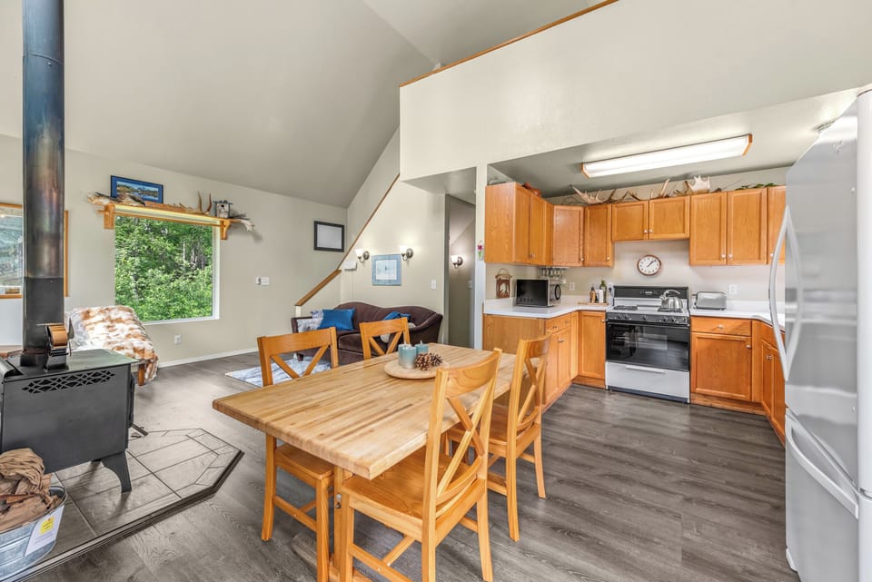 Open-concept dining area with seating for 6 (four shown)