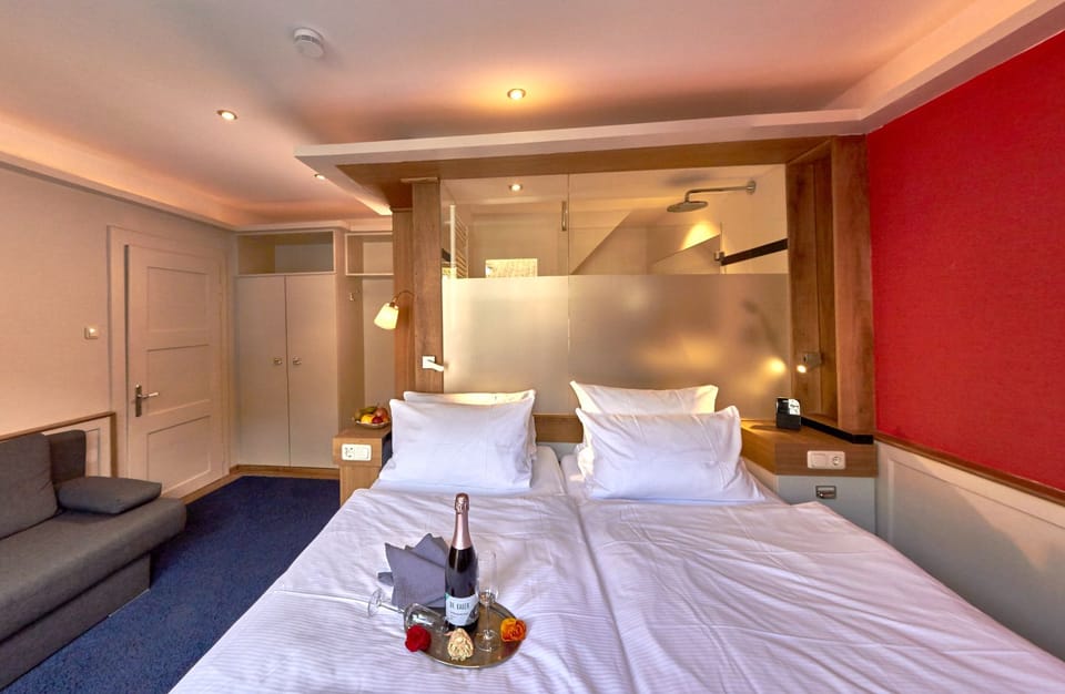 Family Room, 1 Queen Bed with Sofa bed | Minibar, in-room safe, individually decorated, blackout drapes