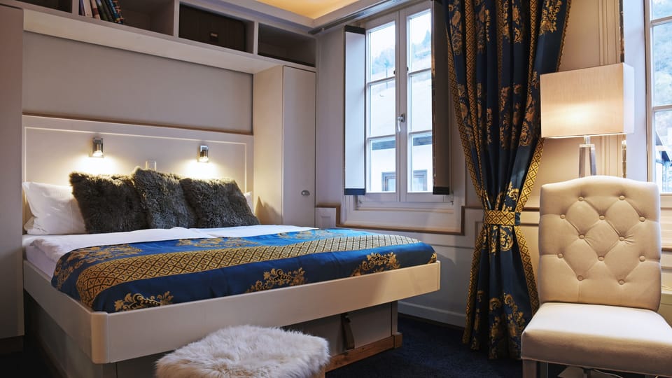 Classic Double Room | Minibar, in-room safe, individually decorated, blackout drapes
