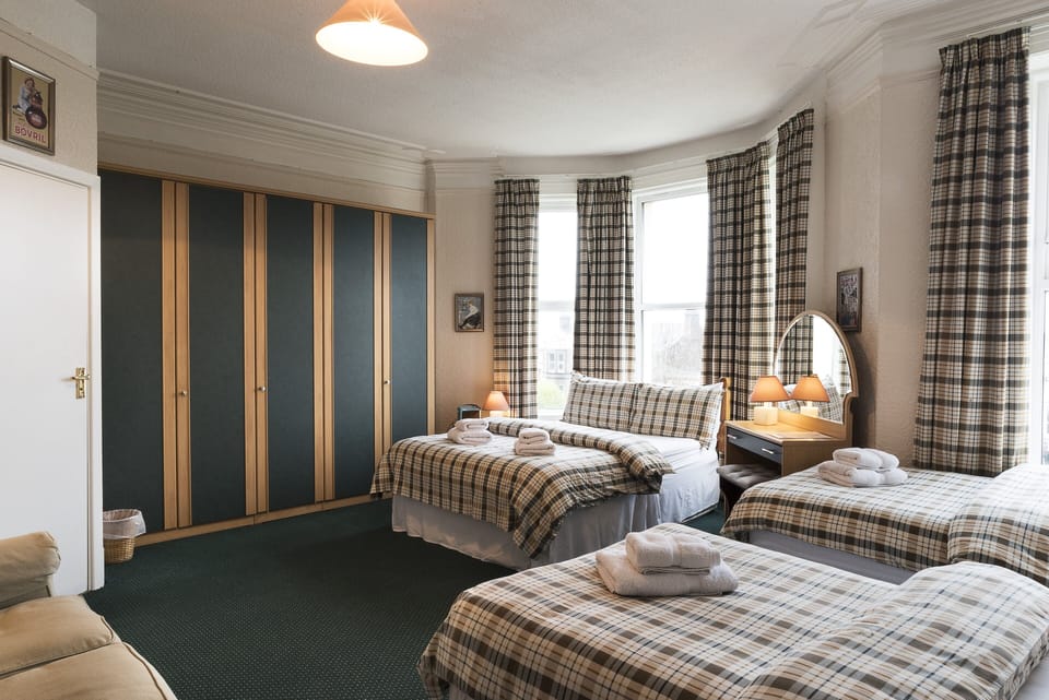 Comfort Quadruple Room, Partial Sea View | Desk, blackout drapes, iron/ironing board, free WiFi