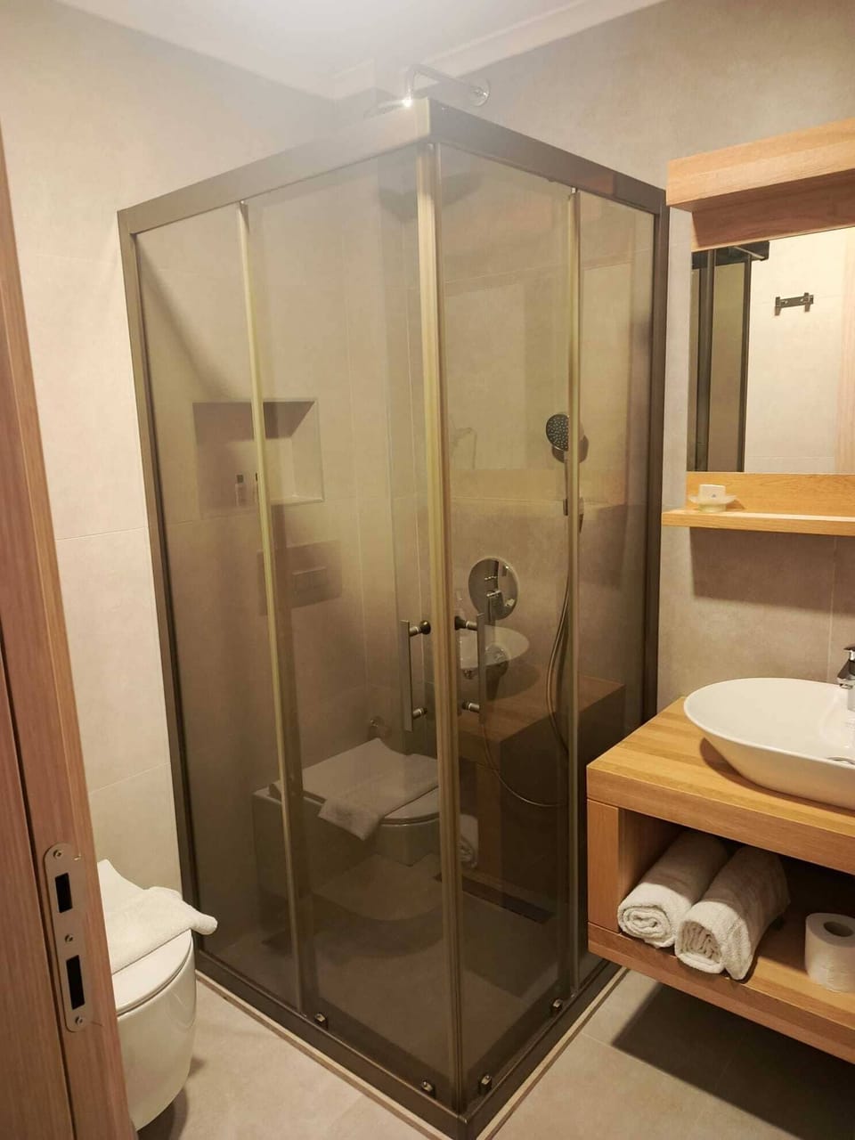 Shower, hair dryer, slippers, towels