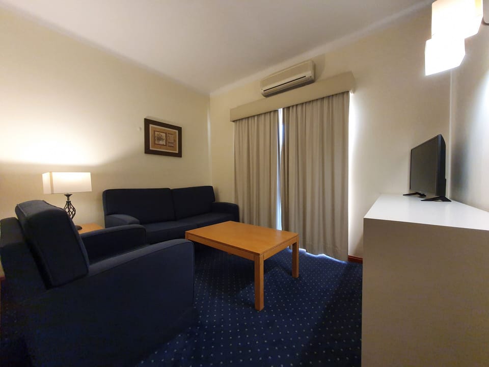 Suite | Living area | 30-cm plasma TV with digital channels, TV