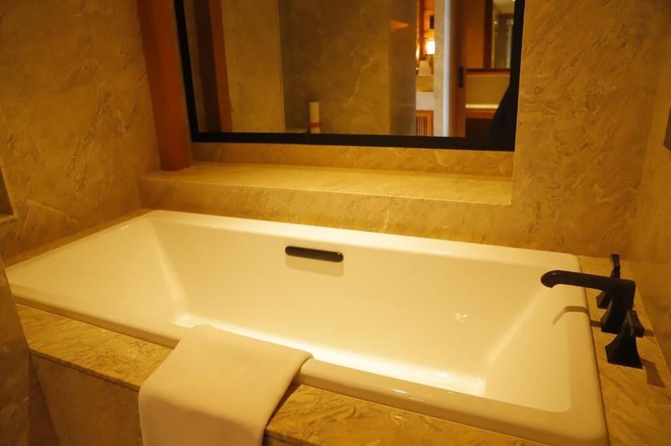 Separate tub and shower, rainfall showerhead, hair dryer, bathrobes