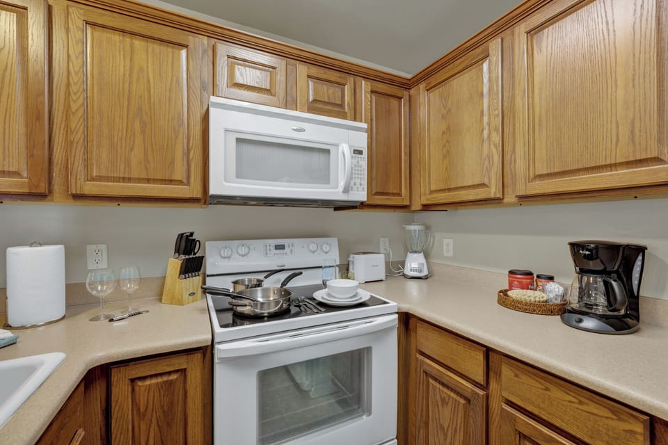 automatic drip coffee maker, coffee, sugar, and creamer provided