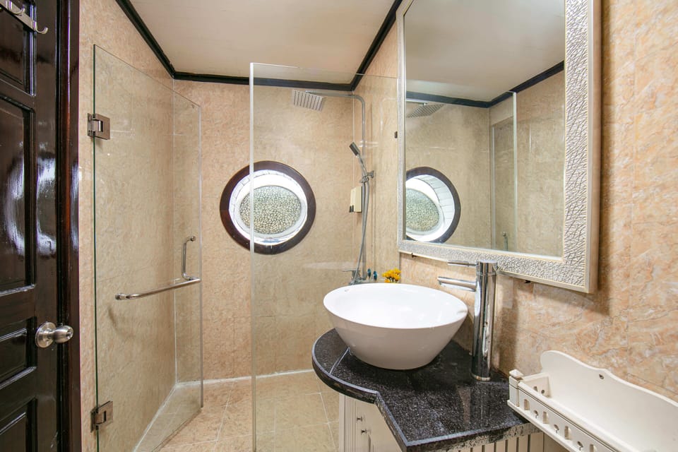 Shower, rainfall showerhead, designer toiletries, hair dryer
