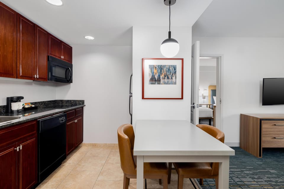 Suite, 1 Bedroom | Private kitchen | Fridge, microwave, stovetop, dishwasher