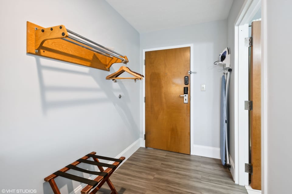 Desk, laptop workspace, blackout drapes, iron/ironing board